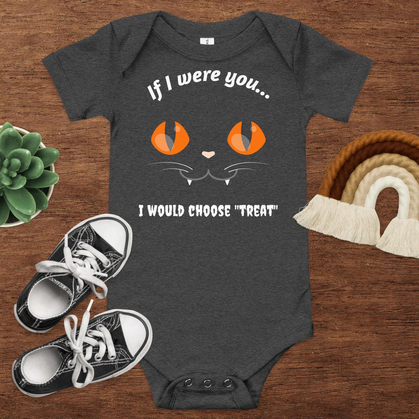 An image of a baby onesie in dark gray with a cat face and text that reads "If I were you, I would choose treat"